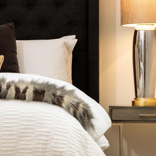 Bedroom options to fit every lifestyle a bed with a lamp on the side